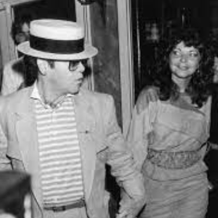 Renate Blauel holding hands with her ex-husband Elton John.
